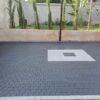 Square cobbles paving blocks on a modern black driveway with white centre pattern – Cabro Blocks Kenya