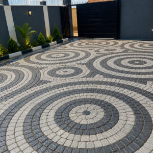 Cobblestone driveway design Kenya black and grey paving pattern