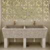 Modern terrazzo laundry room sink with natural lighting and proper drainage in Kenya