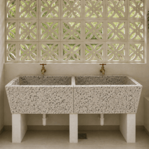 Modern terrazzo laundry room sink with natural lighting and proper drainage in Kenya